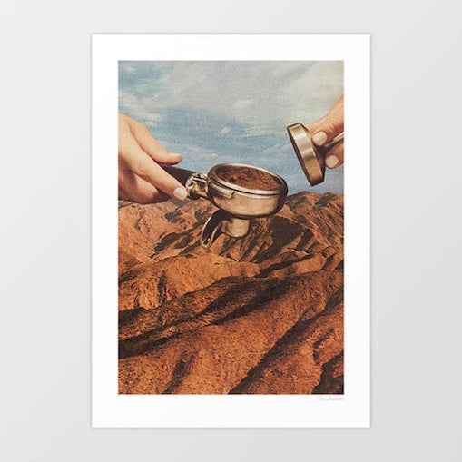 Barista Coffee County surreal art print — two manicured barista hands holding a portafilter loaded with dark espresso grounds and a tamper over a vast terracotta red rock desert canyon landscape, the warm brown coffee grounds matching the geological earth tones exactly, surreal coffee culture wall art for cafes coffee shops kitchens and espresso lovers