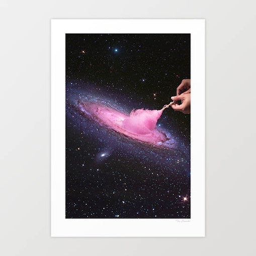 Surreal art print — a hand pulls apart the Andromeda galaxy like pink cotton candy against a deep starry night sky, cosmic fairground wall art by Vertigo Artography