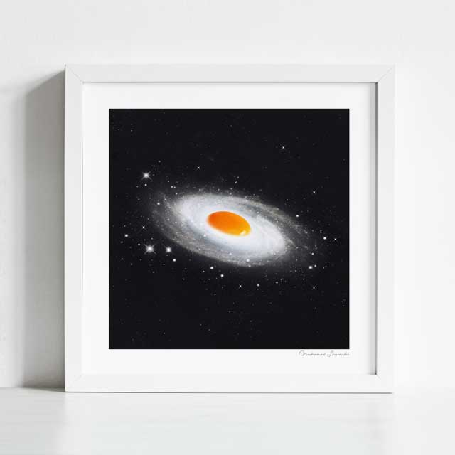 Cosmic Egg art print framed view — vintage surreal collage of sunny side up egg as a radiant celestial body in deep space, quirky galaxy food wall art for cafés and gallery walls