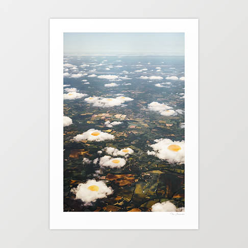 "Eggy Clouds" by Vertigo Artography - a surreal landscape art piece featuring clouds resembling fried eggs. Perfect for contemporary and whimsical art lovers. Unique nature inspired wall art with a touch of whimsy for sale.