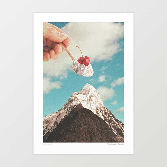 Surreal art print — a hand lifts a vanilla ice cream scoop with a red cherry from a snow-capped mountain peak against a blue sky, the summit and the sundae perfectly mirrored, quirky food wall art by Vertigo Artography
