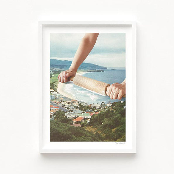 Surreal square art print — a hand rolling a wooden rolling pin along a sandy shoreline, smoothing ocean waves like bread dough, retro coastal baking wall art by Vertigo Artography