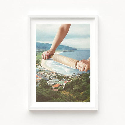 Surreal square art print — a hand rolling a wooden rolling pin along a sandy shoreline, smoothing ocean waves like bread dough, retro coastal baking wall art by Vertigo Artography