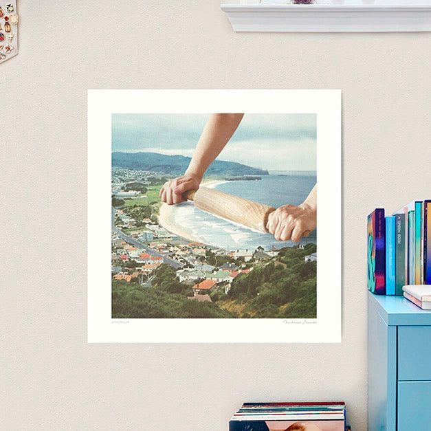 Surreal beach scene with rolling pin creating surf waves - playful coastal wall art for bakeries